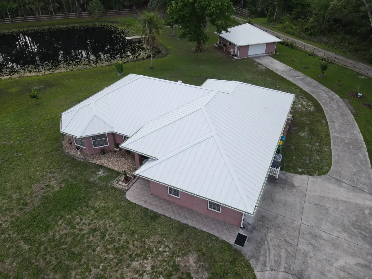 Drone left view of the finished white metal roof in Cocoa, Florida
