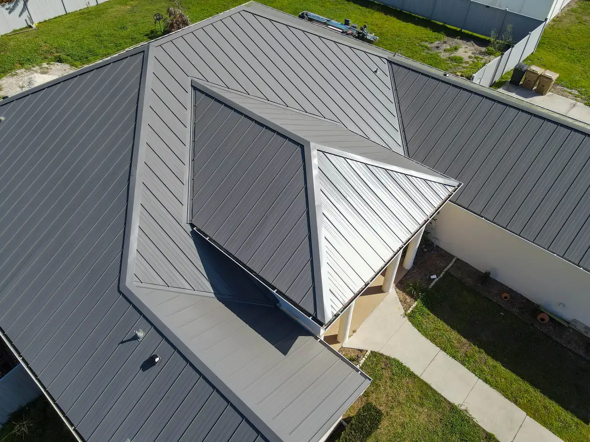 Drone view of a grey standing seam metal roof on a Kissimmee, Florida home