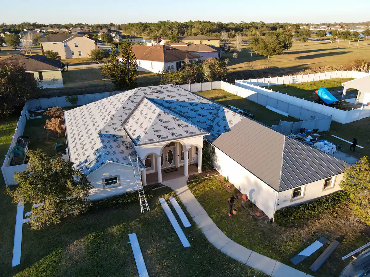Wide drone view of the Kissimmee property during the metal roof install
