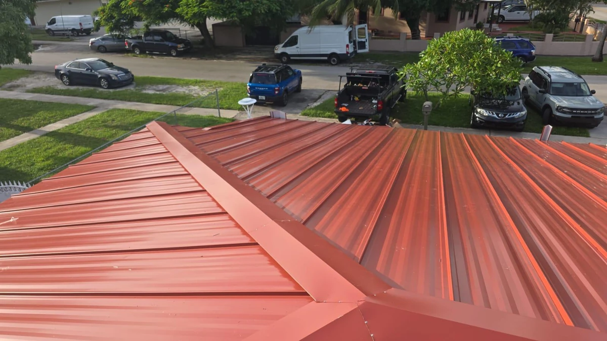 Front-right view of the finished red standing seam metal roof in Orlando, Florida