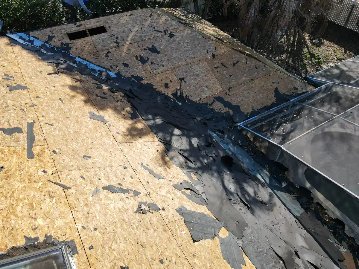 Bare wood decking exposed across the Orlando roof once the shingles came off