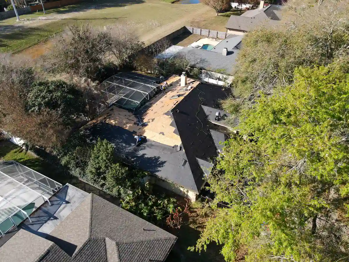 Wide drone view of the Orlando property with the tear-off underway